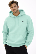 Man wearing a light blue hoodie with a brand logo on a white background